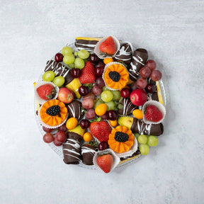 Chocolate covered fruit strawberries pineapple bananas dark chocolate white drizzle