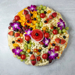 Gourmet cheese fruit platter assorted cheeses strawberries grapes olives tomatoes